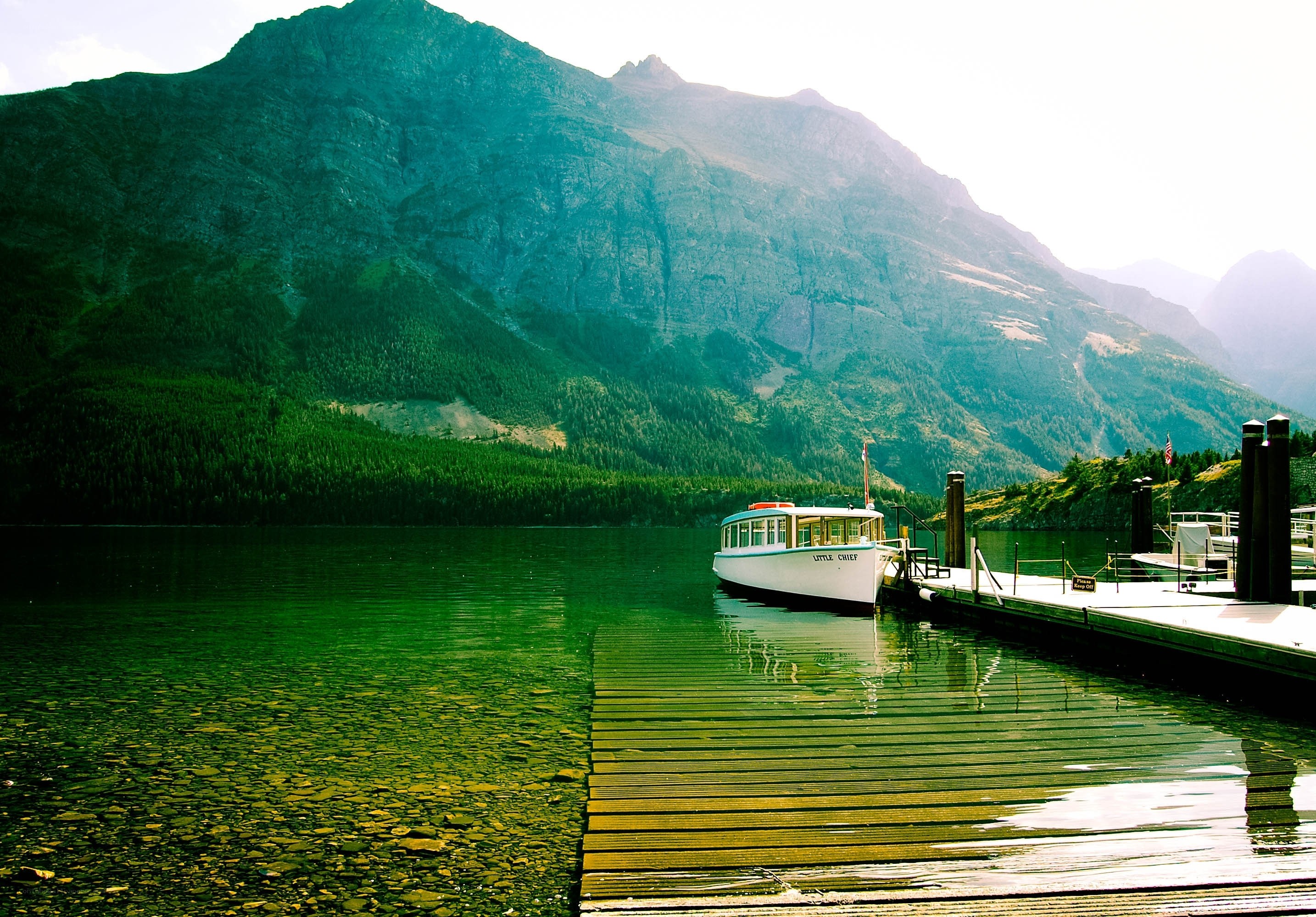 Boat at a mountain lake dock