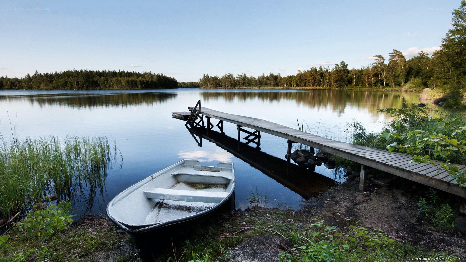 Boat at a quiet lakeside dock