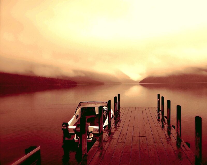 Boat at dock during sunset