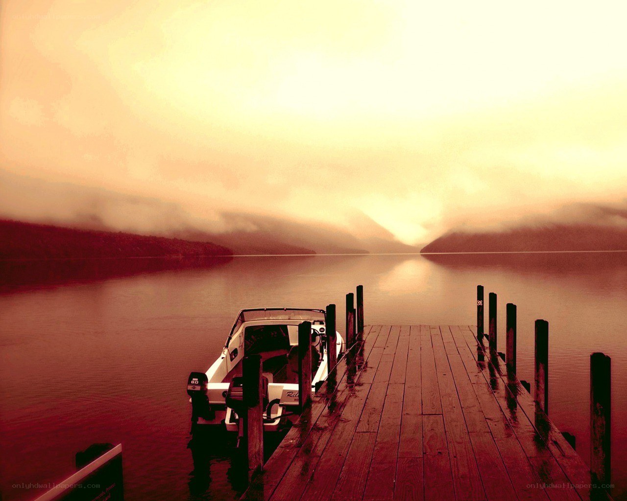 Boat at dock during sunset