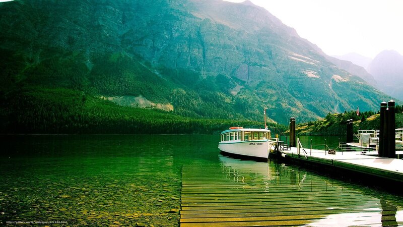 Boat at dock in mountain lake