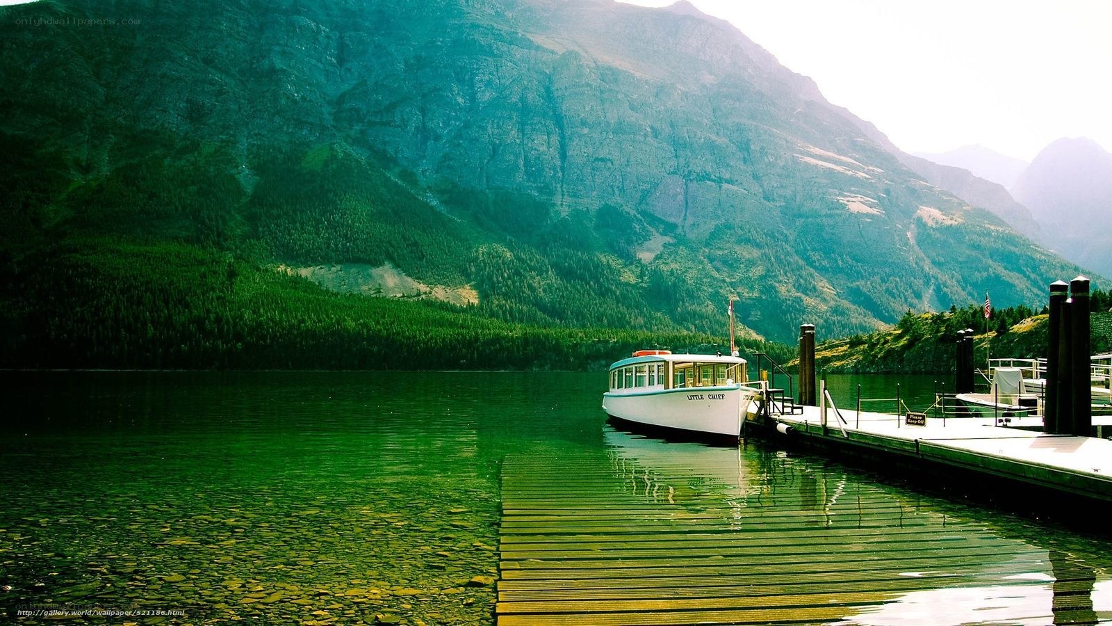 Boat at dock in mountain lake
