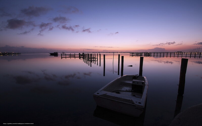 Boat at dusk by the dock