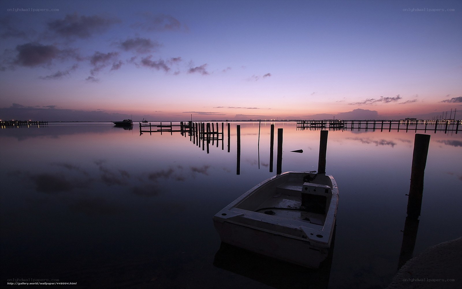 Boat at dusk by the dock