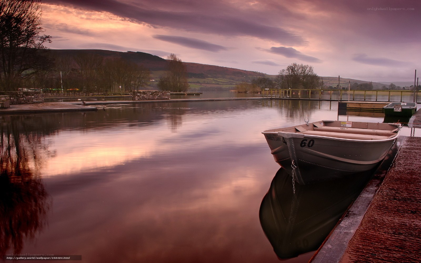 Boat at dusk on a calm lake