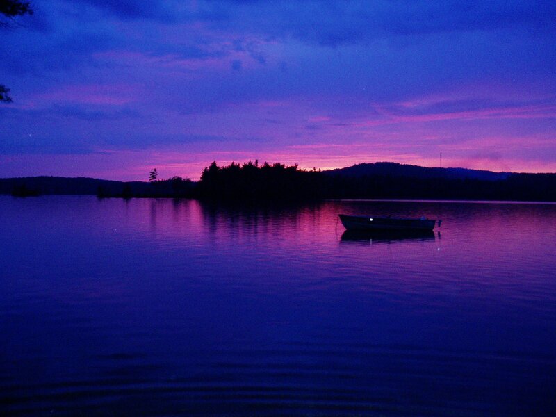 Boat at dusk on a lake