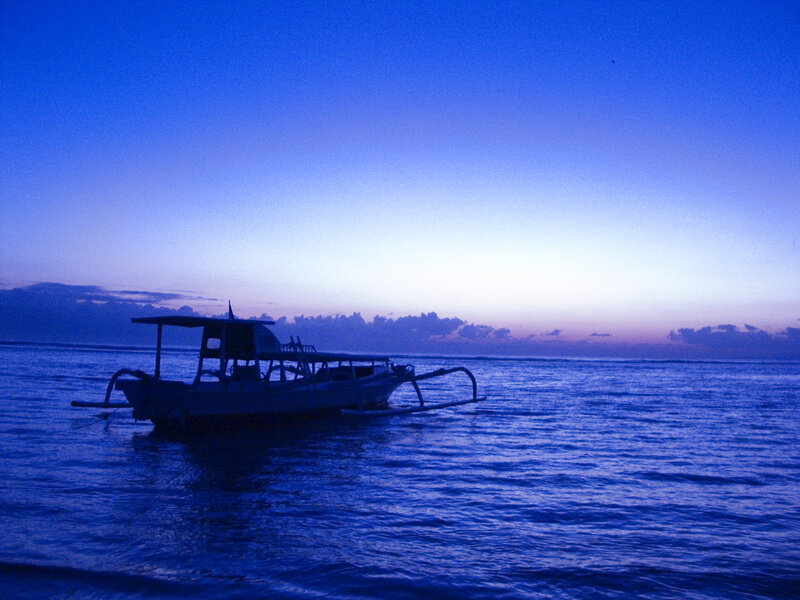 Boat at dusk on the ocean
