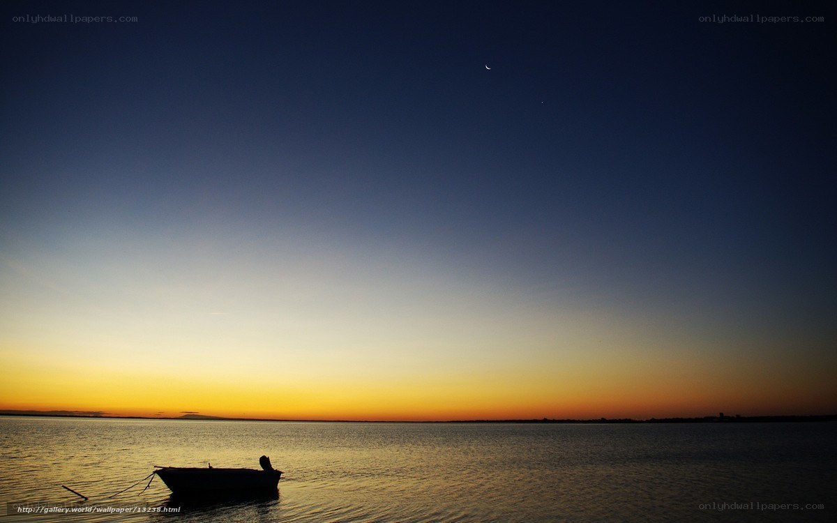 Boat at dusk with crescent moon