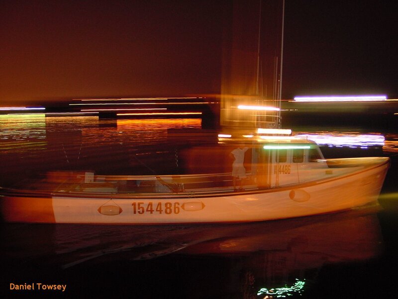 Boat at night with light trails