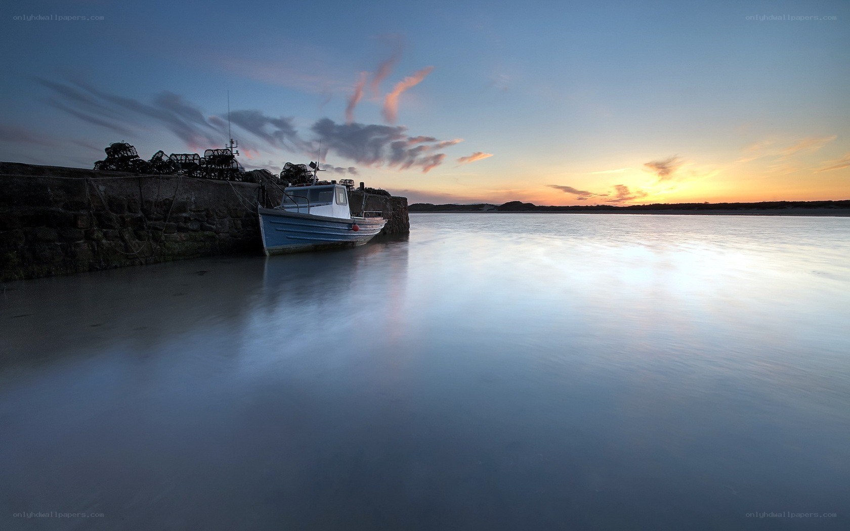 Boat at sunset by the harbor