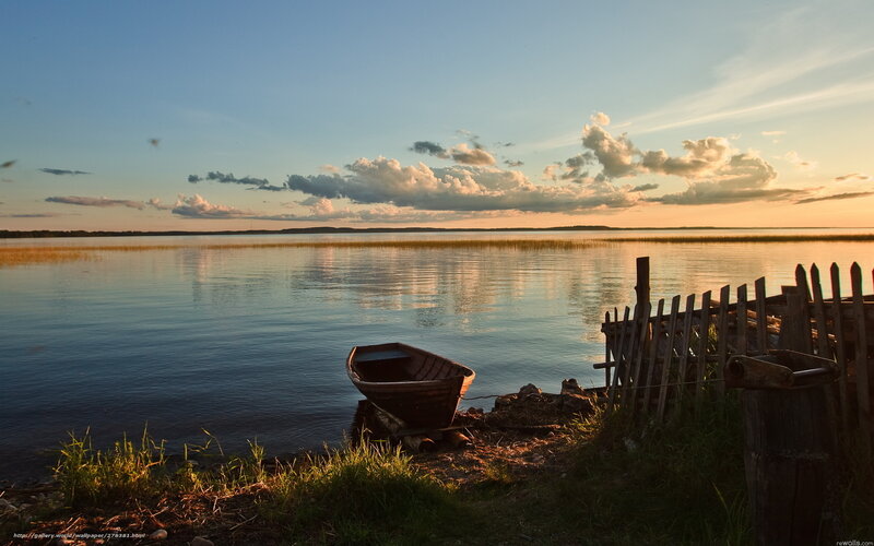Boat at sunset by the lake