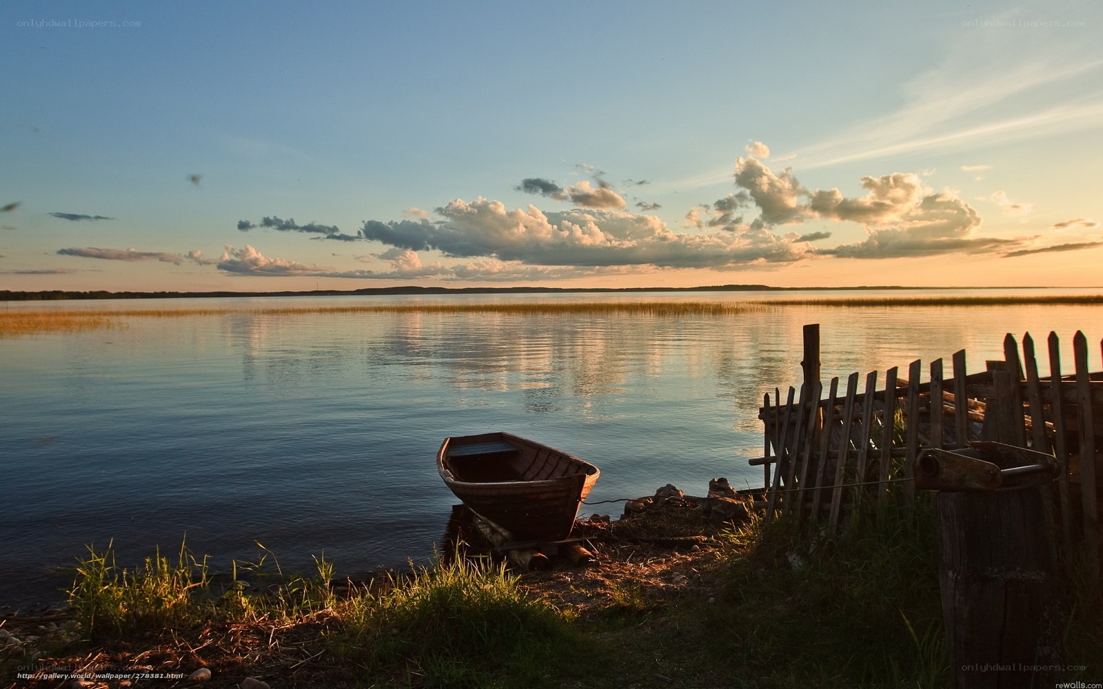 Boat at sunset by the lake