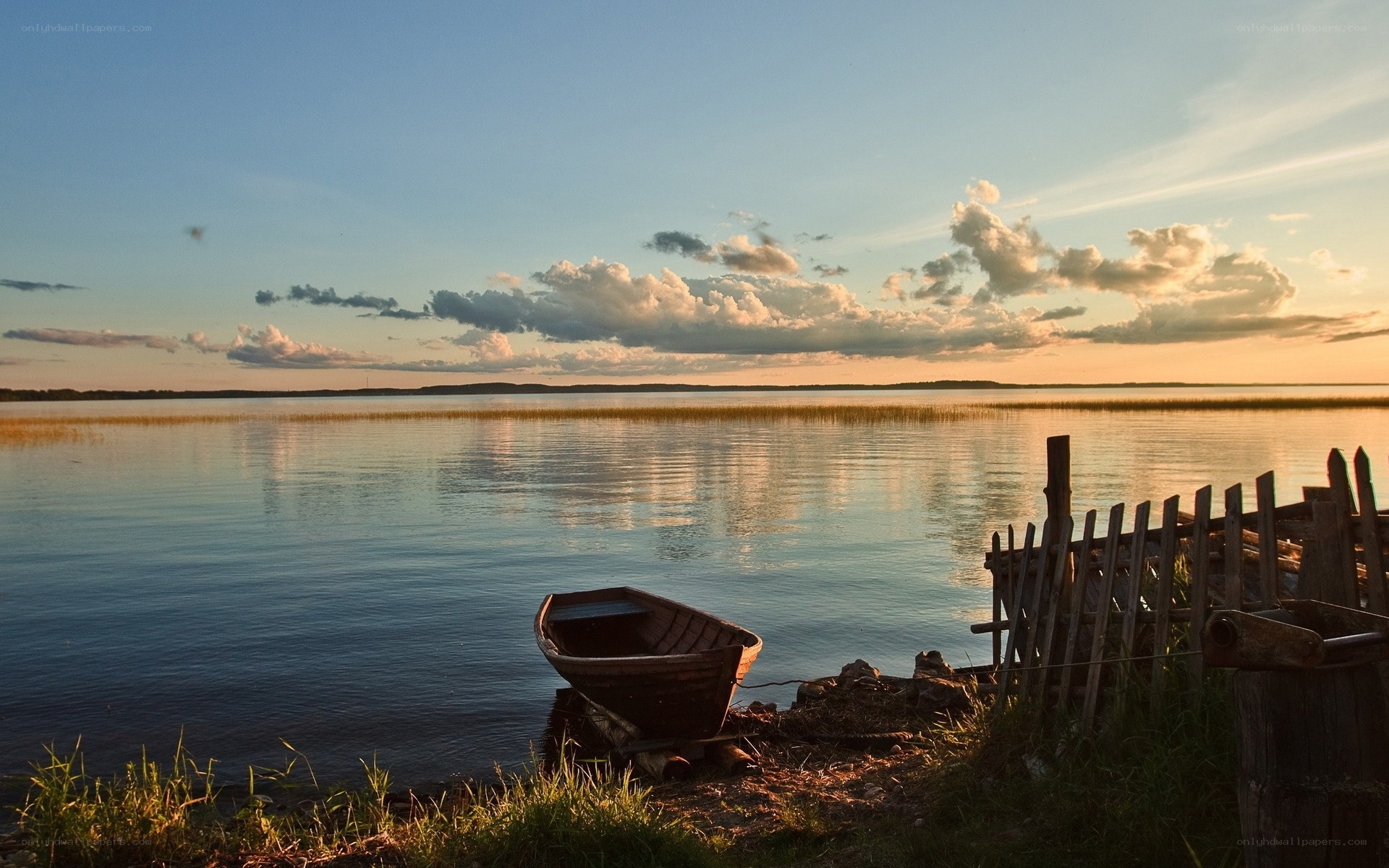 Boat at sunset by the lake