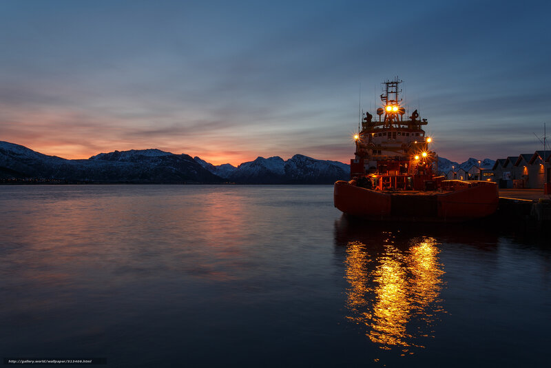 Boat at sunset in a fjord