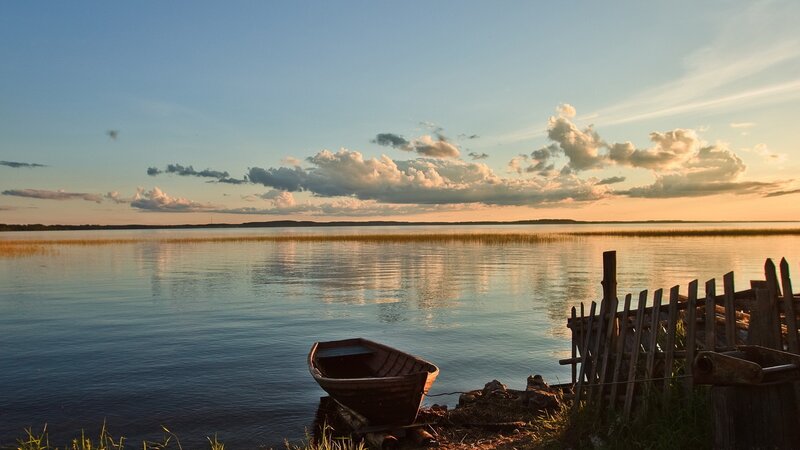 Boat at sunset on a calm lake