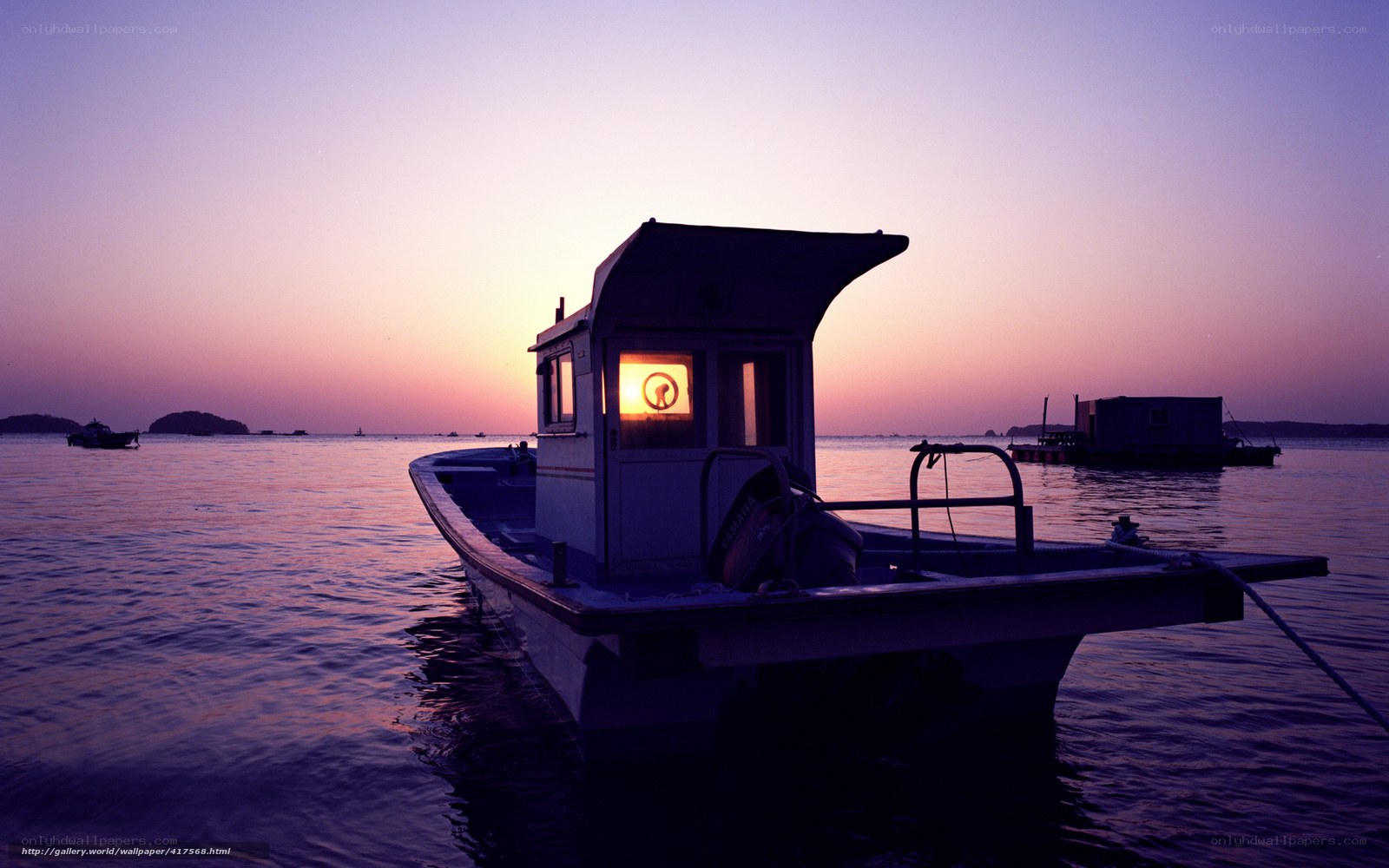 Boat at sunset on calm water