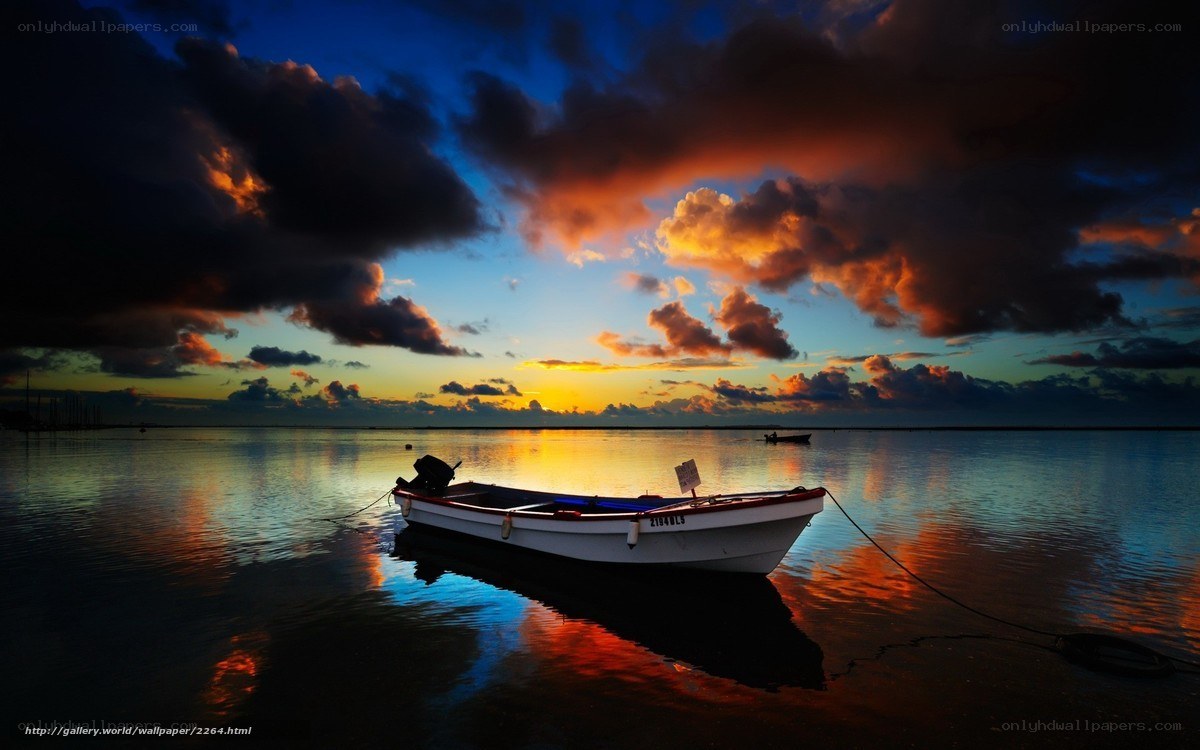 Boat at sunset on calm water
