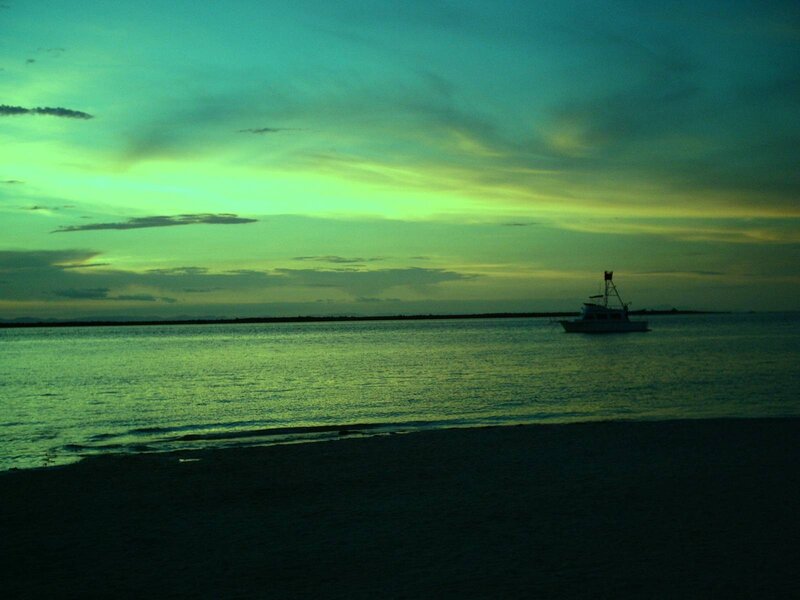 boat at sunset on the beach