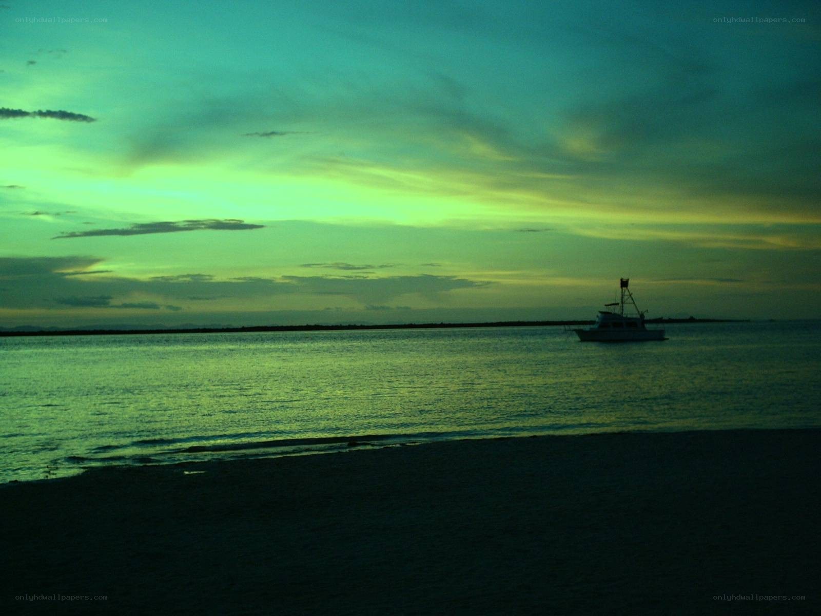 boat at sunset on the beach