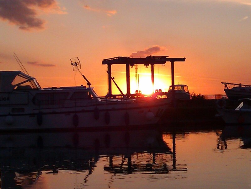Boat at Sunset — Orange, Serene