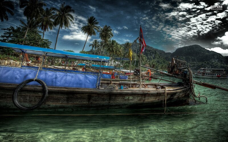 Boat at tropical island harbor