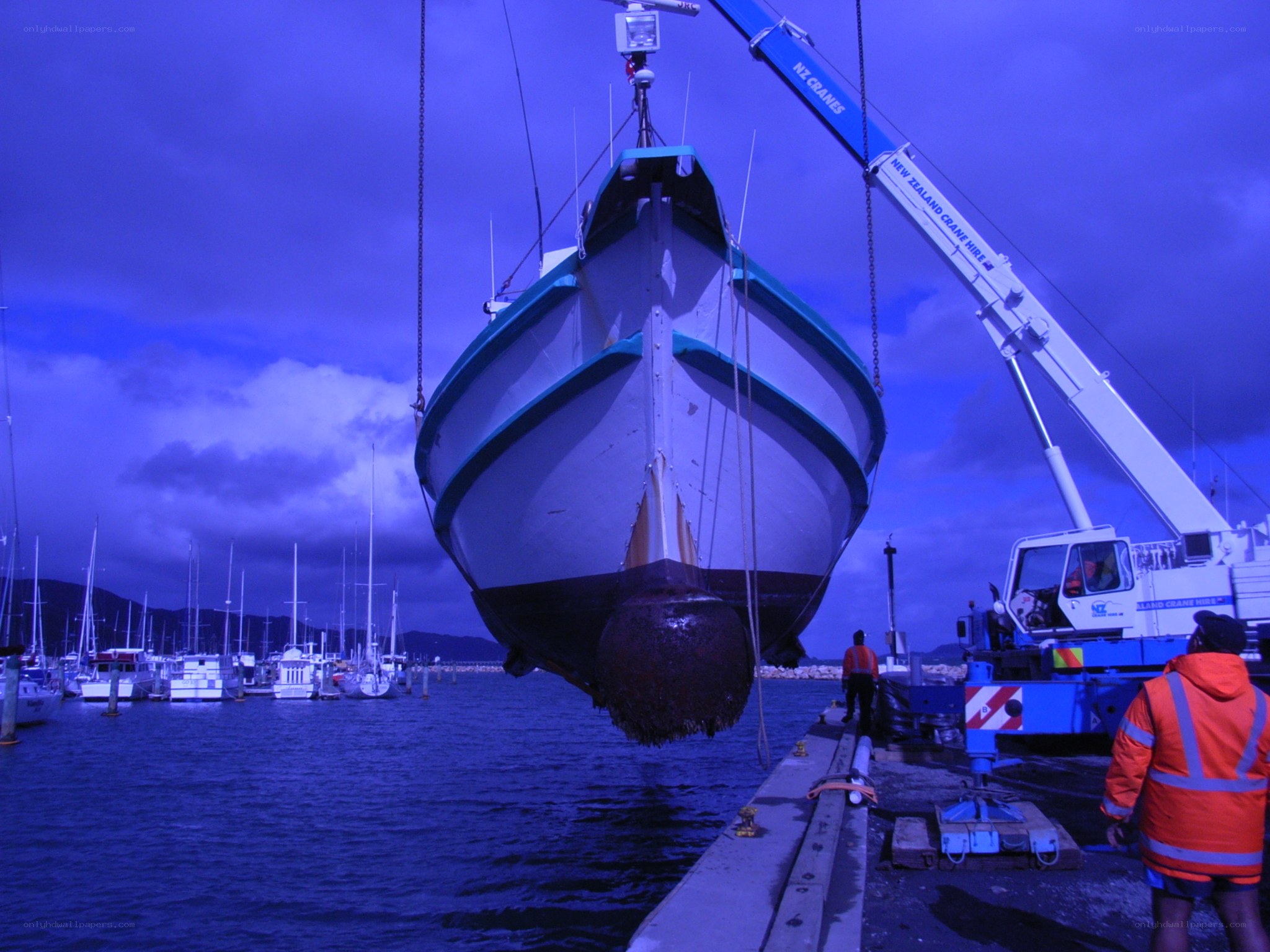 Boat being lifted by crane