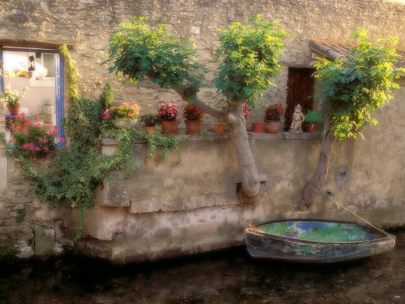 Boat by a flowered wall