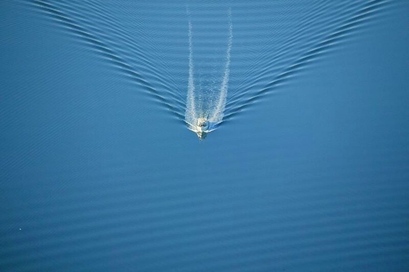 Boat creating V-shaped wake