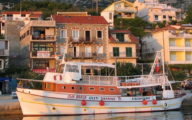 Boat docked in coastal town