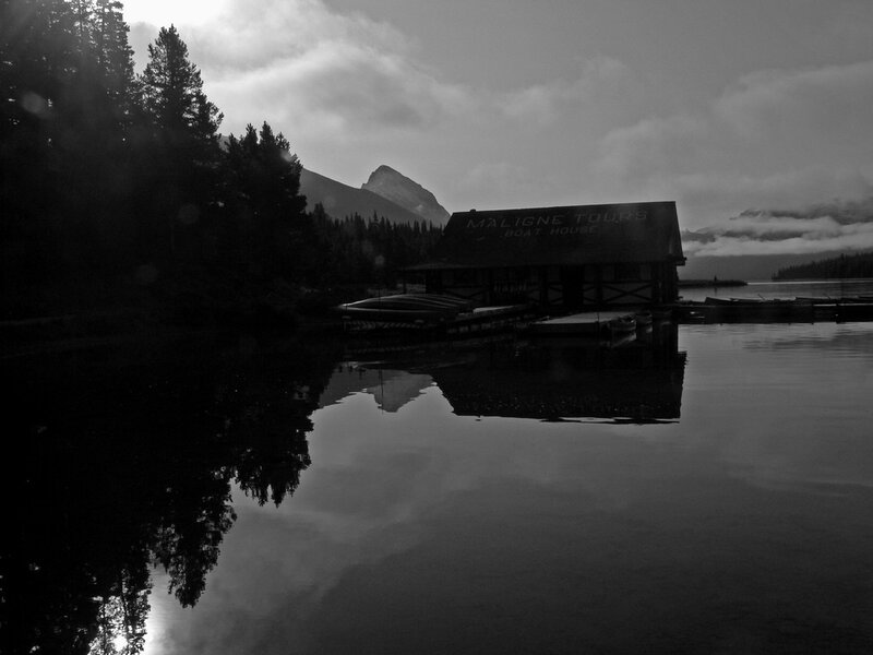 Boat house at lake with mountain