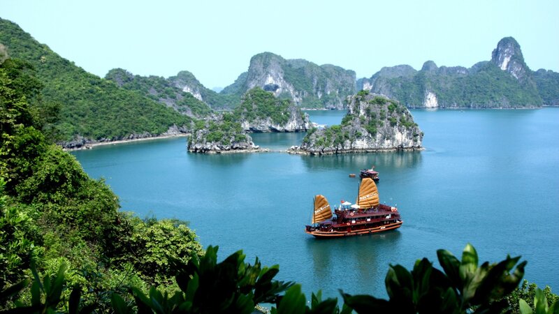 Boat in a bay with limestone islands