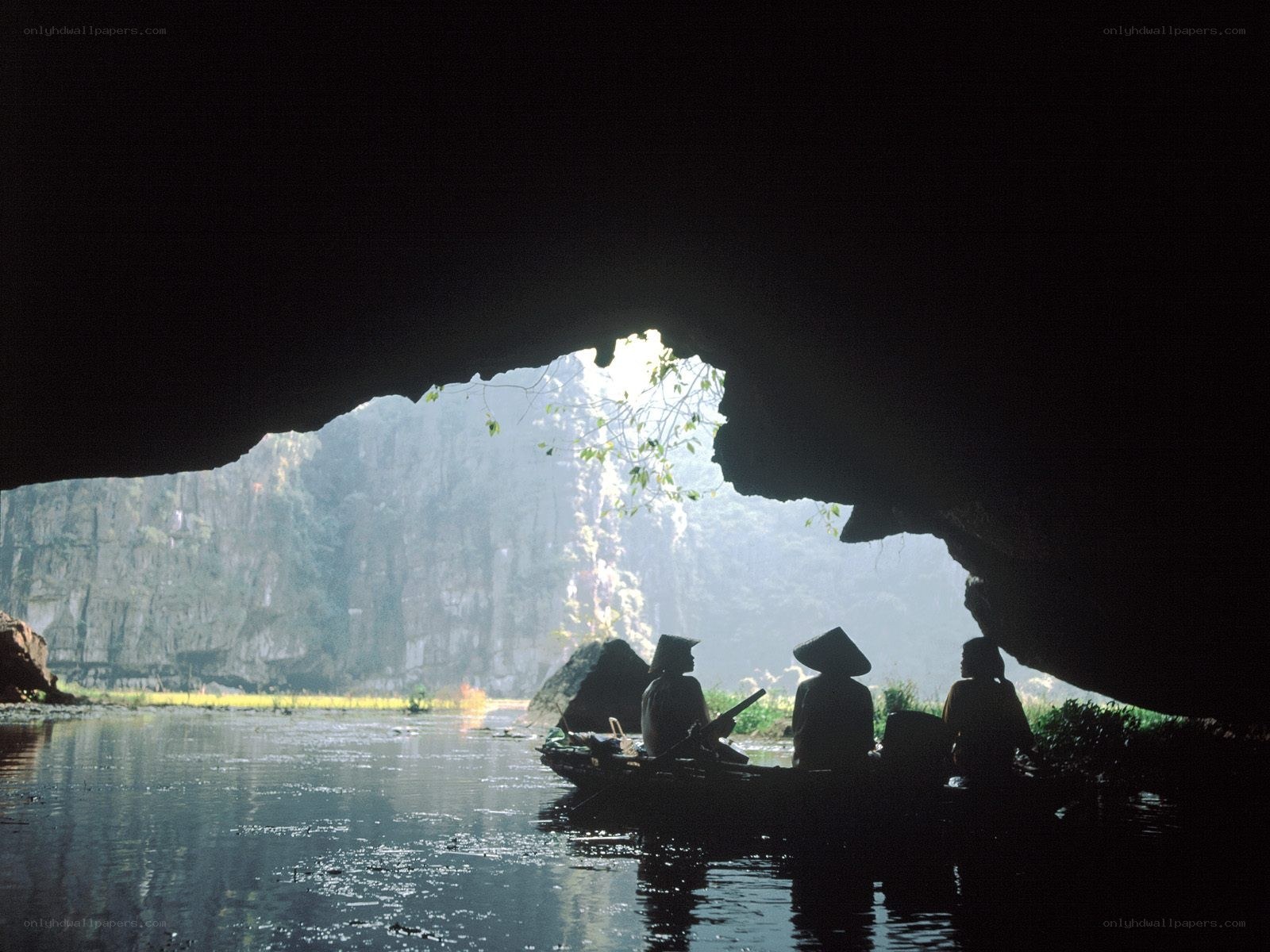 Boat in a cave entrance