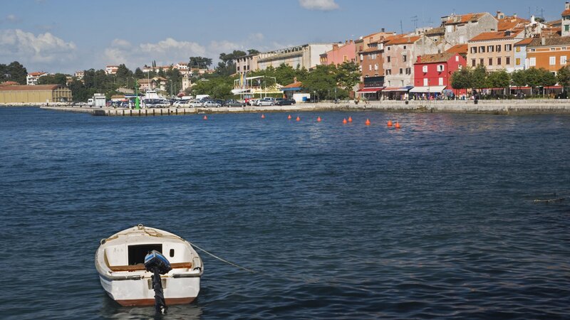 Boat in a coastal town harbor