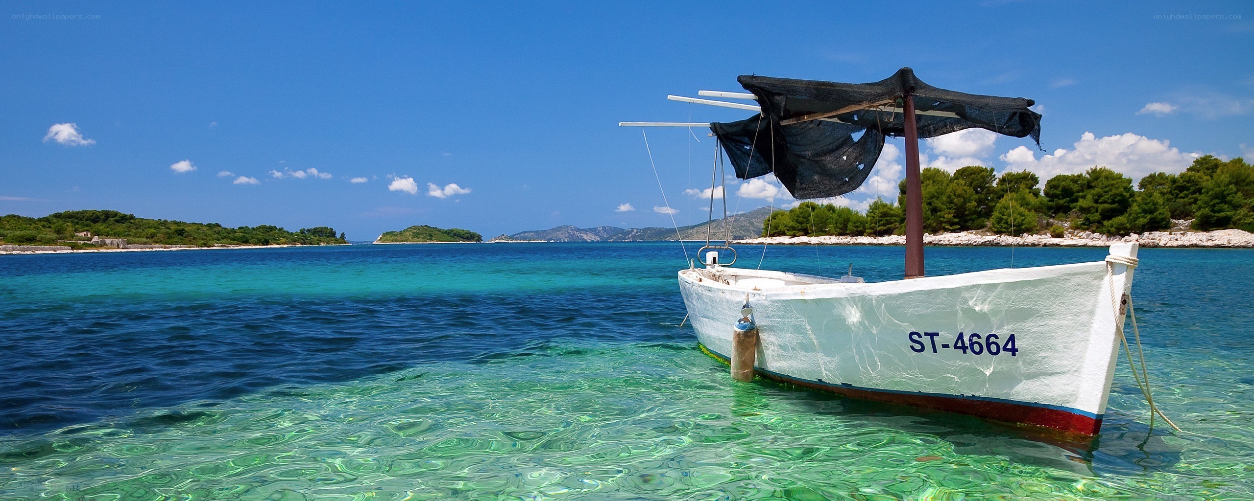 Boat in clear blue water