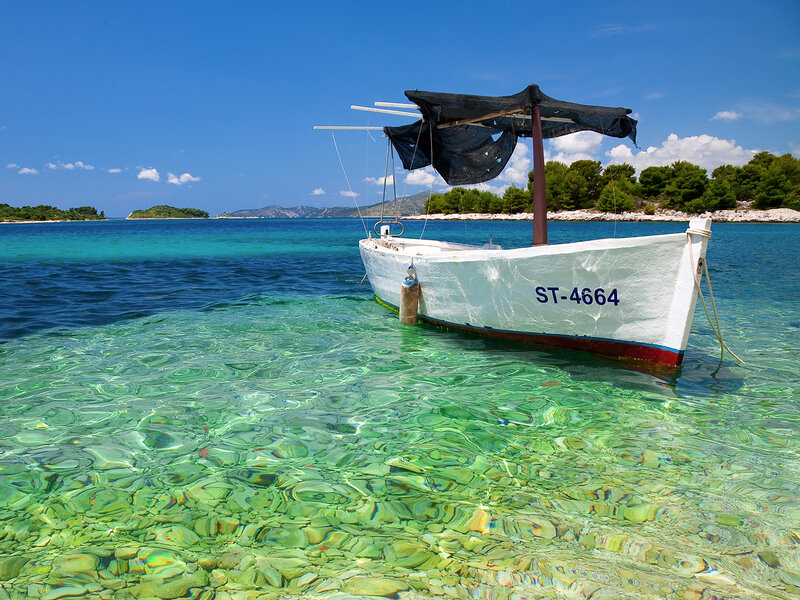 Boat in clear turquoise water