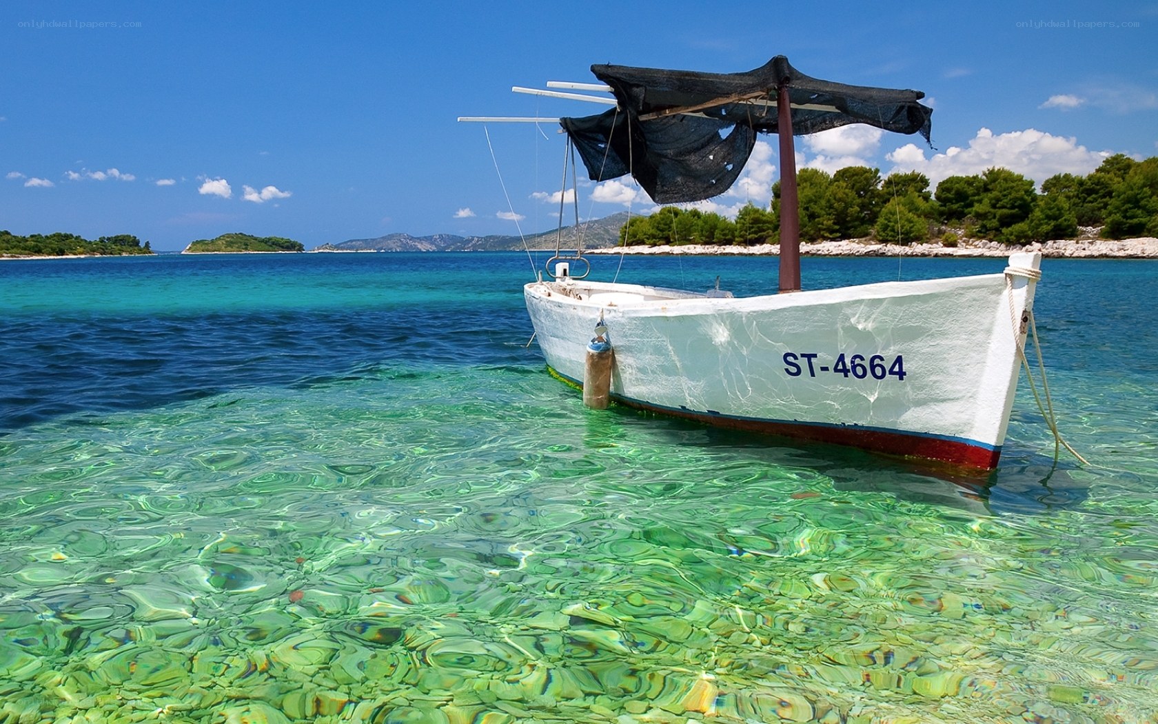 Boat in clear turquoise water