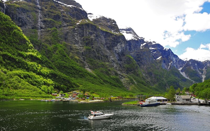 Boat in Fjord with Mountains