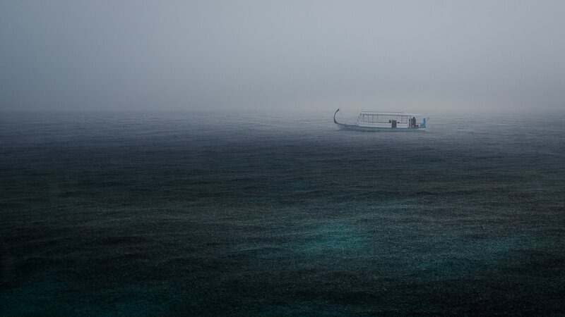 Boat in Foggy Sea