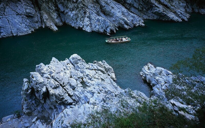 Boat in River Canyon — Blue