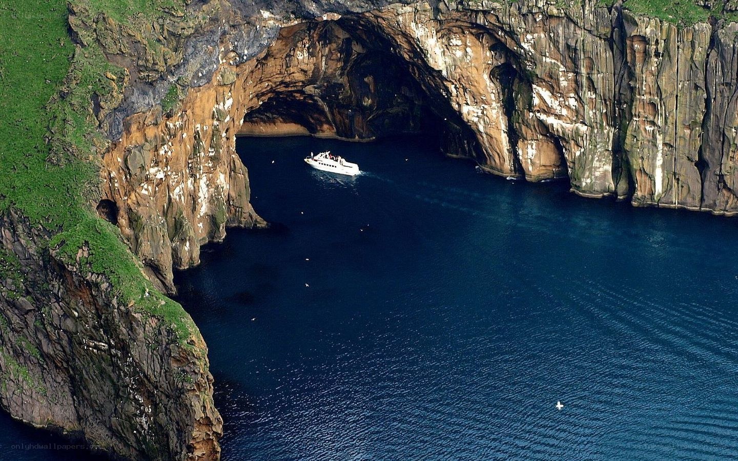 Boat in sea cave