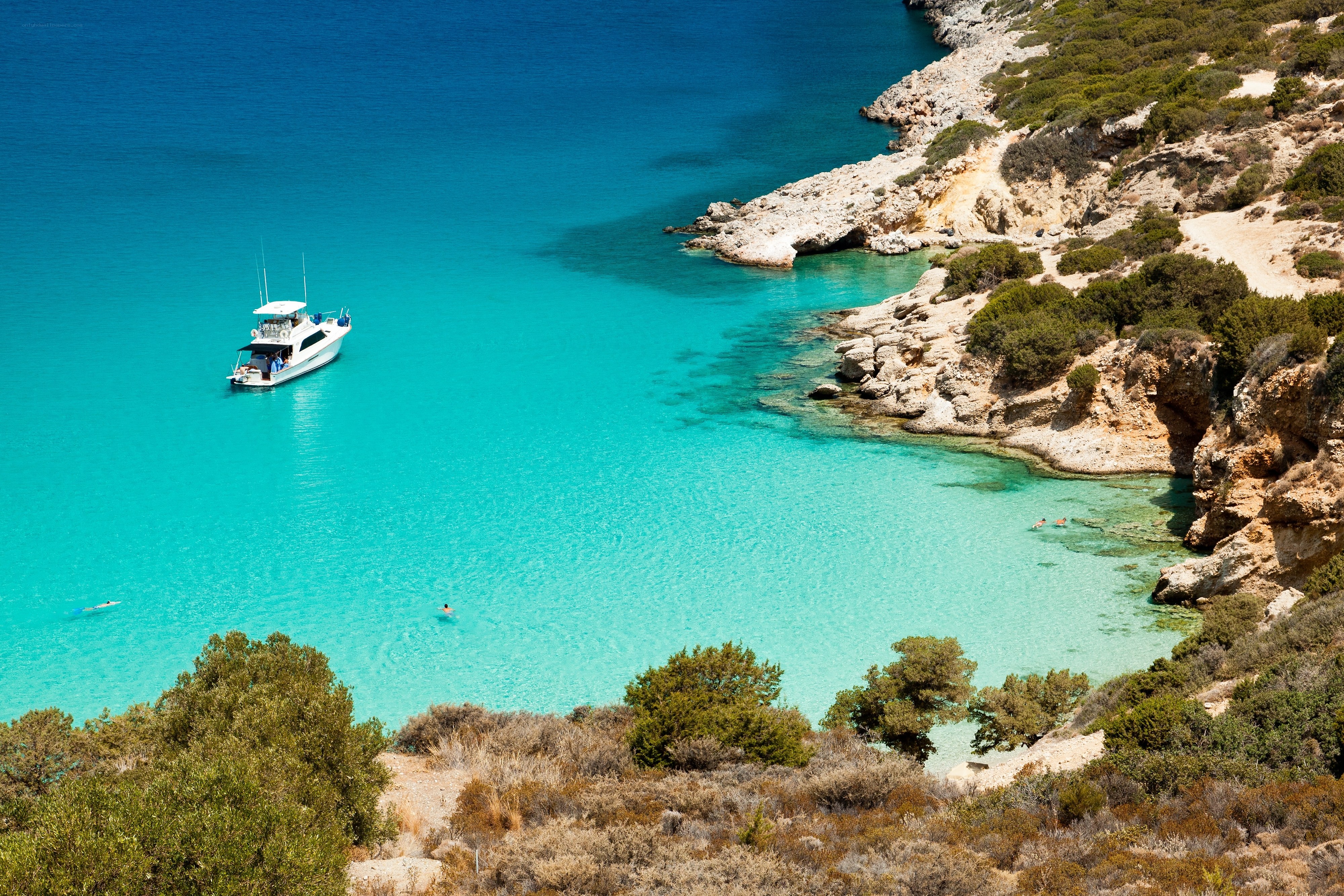 Boat in turquoise cove