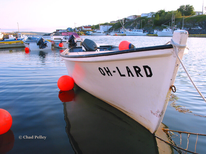 Boat named OH-LARD in harbor