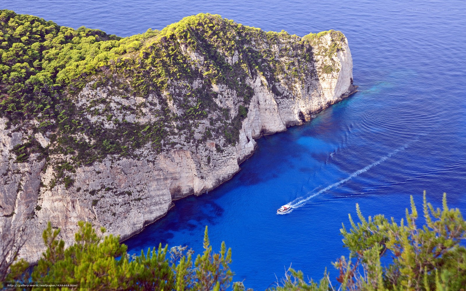 Boat near a cliffside cove