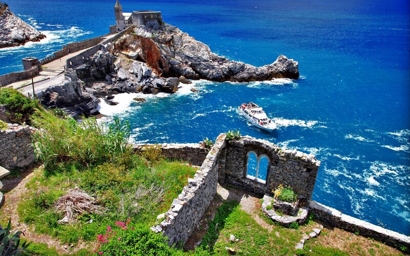 Boat Near Coastal Ruins