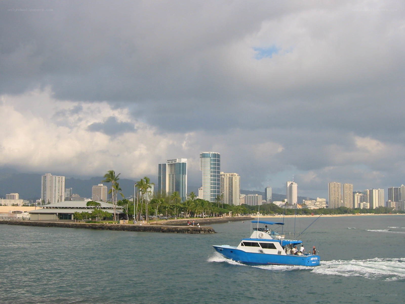 Boat near Honolulu skyline