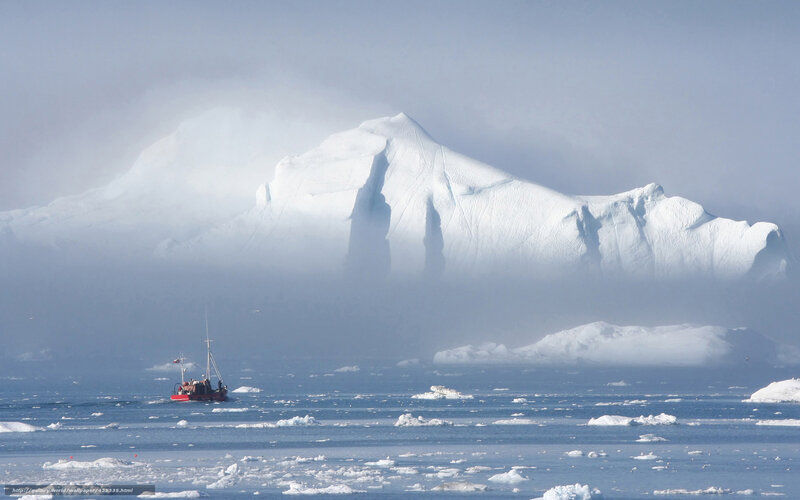 Boat near iceberg in fog