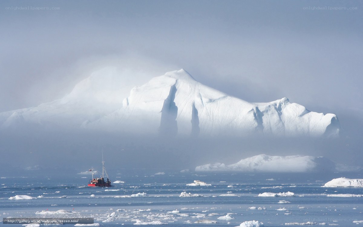 Boat near icebergs in fog