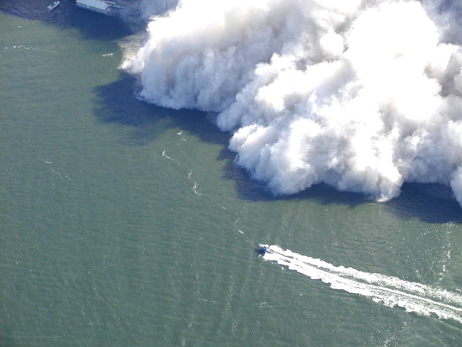 Boat near large water explosion