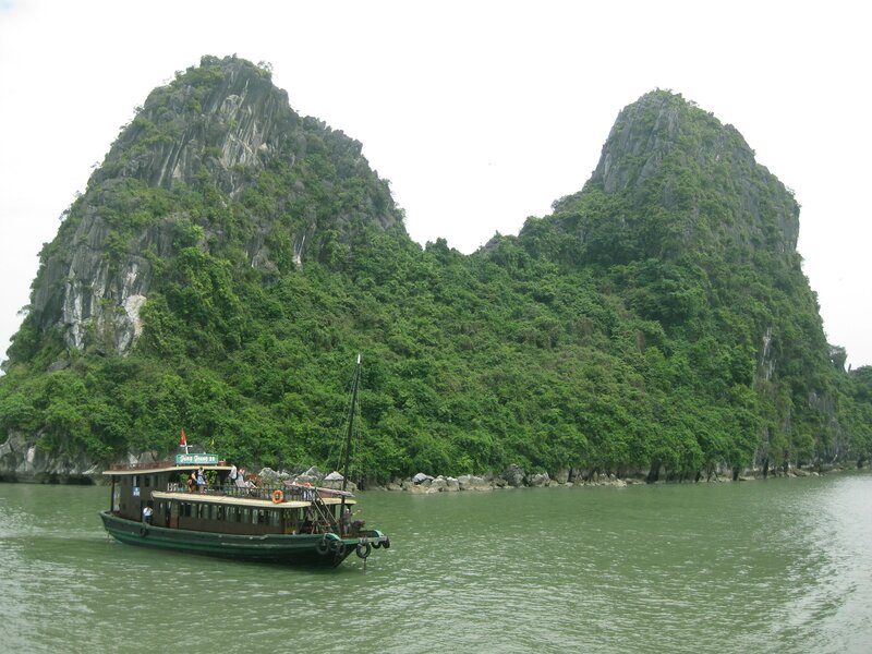 Boat near limestone cliffs