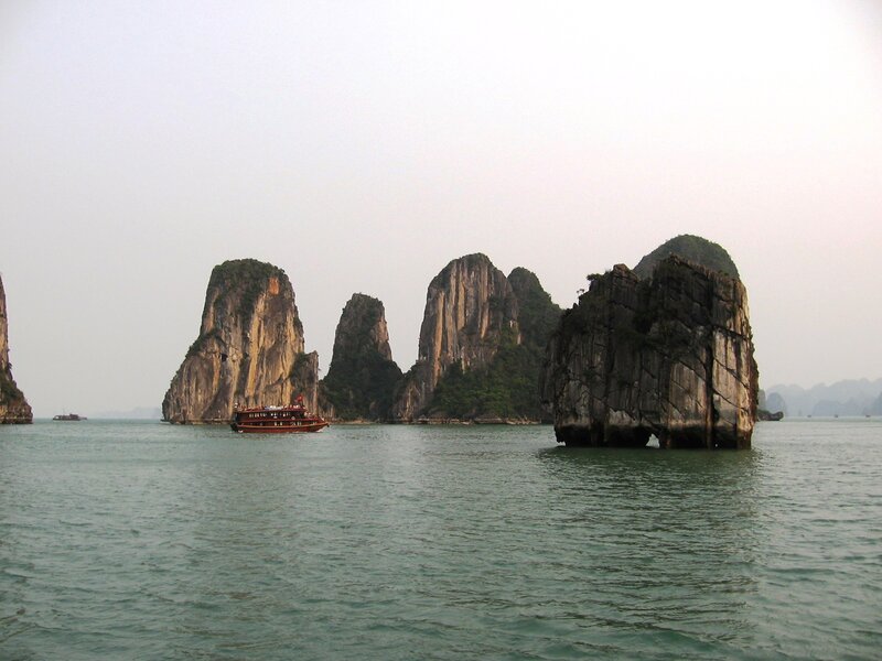 Boat Near Limestone Islands